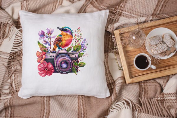 floral camera cross stitch pattern with hummingbird and flowers on decorative pillow case