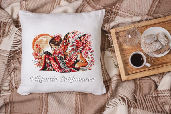 White linen pillow, cushion Mockup on plaid. Inrerior photo Elf girl and fox cross stitch design displayed on decorative pillow for nursery décor and kids room