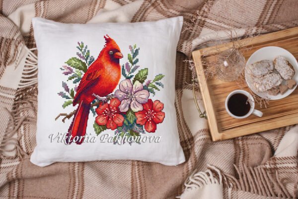 White linen pillow, cushion Mockup on plaid. Inrerior photo Floral cardinal cross stitch design displayed on decorative pillow