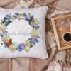 Decorative pillow with cornflower wreath and butterfly cross stitch embroidery