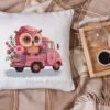 Baby owl and pink truck cross stitch artwork surrounded by plush toys, colorful children’s decor