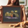 Framed cross stitch artwork featuring two cats in love with warm colors, dreamy trees and gentle decorative elements
