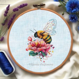 9 Peony and bee cross stitch pattern in a wooden embroidery hoop, detailed botanical floral design in pink and yellow tones