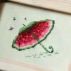 A_zdAZyFqYc framed embroidery with watermelon colors and playful umbrella design