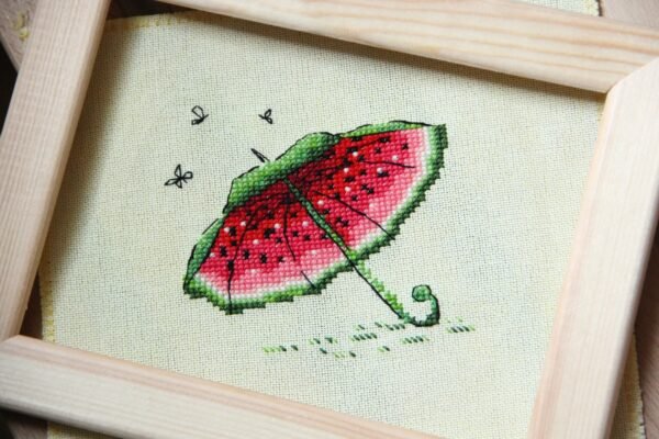 A_zdAZyFqYc framed embroidery with watermelon colors and playful umbrella design
