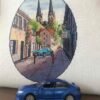 Finished embroidery of Neuruppin Germany cross stitch pattern with European cityscape and blue car