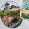 Finished embroidery of Karlstein Castle cross stitch artwork with European village and castle towers