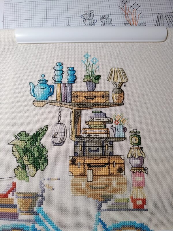 close‑up of bicycle and books embroidery with bright colors