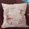 Decorative pillow with barn owl and mushroom wreath cross stitch design, cozy autumn home decor