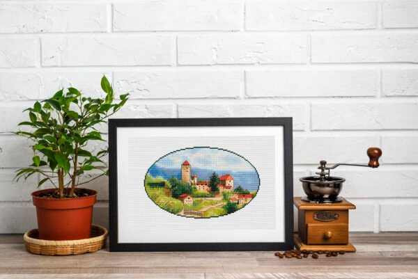 blank-frame-flower-pot-grinder Framed Tuscany countryside cross stitch artwork with hills and Italian houses, warm summer embroidery