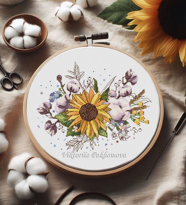 Sunflower and cotton cross stitch pattern in embroidery hoop with colorful floral details