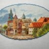 Krakow city cross stitch artwork with historic European buildings, vibrant architecture embroidery