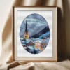 Framed Hallstatt Austria winter cross stitch artwork with snowy mountains and alpine houses