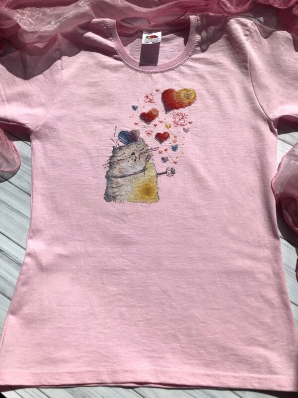 finished cross stitch artwork featuring a cute romantic cat with colorful hearts on t-shirt