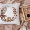 Barn owl cross stitch pillow with mushrooms and leaves, warm rustic fall decor setup