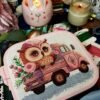 Cute owl on pink truck cross stitch displayed in pink hoop with cozy nursery decor items