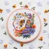 sign 7 Spring bee cross stitch pattern in a wooden hoop with colorful flowers and honeycomb details