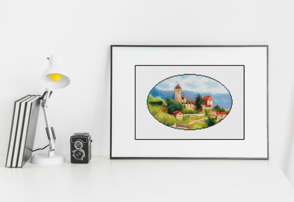 stylish-minimalistic-workplace-white-color-with-whiteboard Framed Tuscany countryside cross stitch artwork with hills and Italian houses, warm summer embroidery