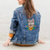 woman-enjoying-sea-view denim mock up with floral husky dog cross stitch design