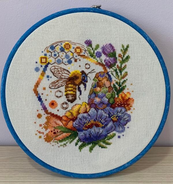 Валерия Петку Spring bee cross stitch pattern in a wooden hoop with colorful flowers and honeycomb details