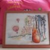 framed fox and raven embroidery with bright trees and balloons