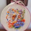 Милена Начева Spring bee cross stitch pattern in a wooden hoop with colorful flowers and honeycomb details