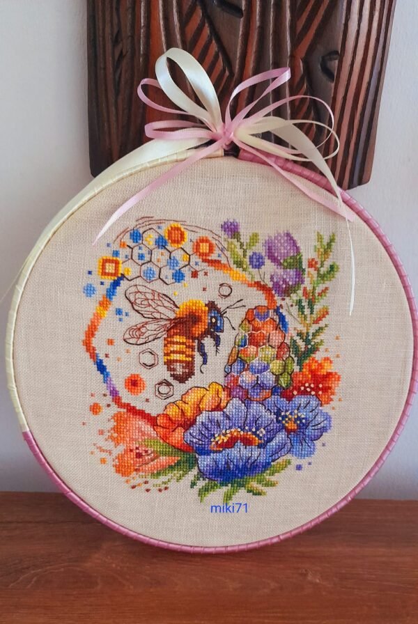 Милена Начева Spring bee cross stitch pattern in a wooden hoop with colorful flowers and honeycomb details