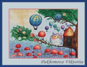 Framed cross stitch artwork of a whimsical owl beside a tiny forest house with colorful mushrooms and balloons