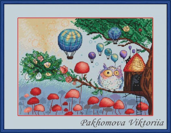 Framed cross stitch artwork of a whimsical owl beside a tiny forest house with colorful mushrooms and balloons