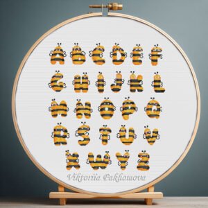 125 Cross stitch embroidery of a colorful bumblebee alphabet with bee‑shaped letters displayed in a wooden hoop