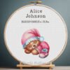 Cross stitch embroidery of a Sleeping Bear birth announcement with space for name, date and stats in a wooden hoop