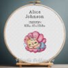 Cross stitch embroidery of a Mermaid Cat birth announcement with space for name, date and stats in a wooden hoop