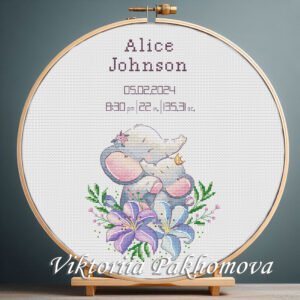 131 Cross stitch embroidery of a personalized elephant birth announcement displayed in a wooden hoop with customizable baby details