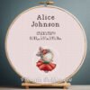 Cross stitch embroidery of a personalized dancing bunny birth stats design displayed in a wooden hoop