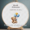 Cross stitch embroidery of a Teddy Bear birth announcement with space for name, date and stats in a wooden hoop