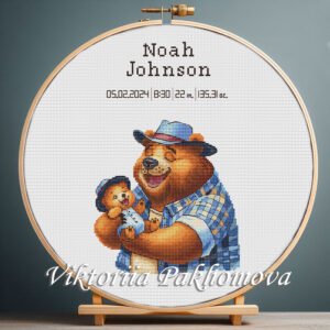 Cross stitch embroidery of a Teddy Bear birth announcement with space for name, date and stats in a wooden hoop
