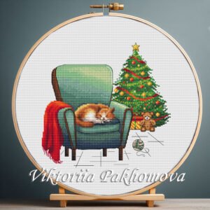 Cozy Christmas cross stitch pattern in a wooden hoop with ginger cat and festive tree