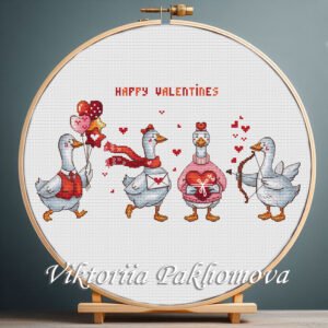 Valentine geese cross stitch displayed in a wooden hoop with romantic holiday details