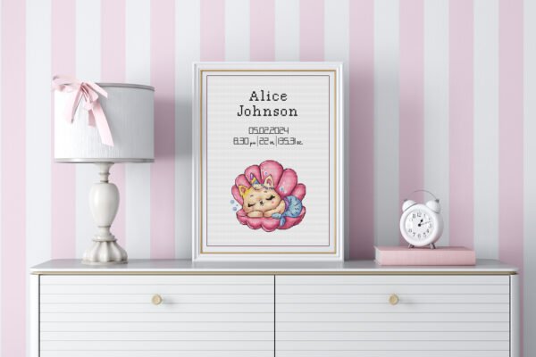 Framed Mermaid Cat cross stitch birth announcement with ocean colors and personalized baby details