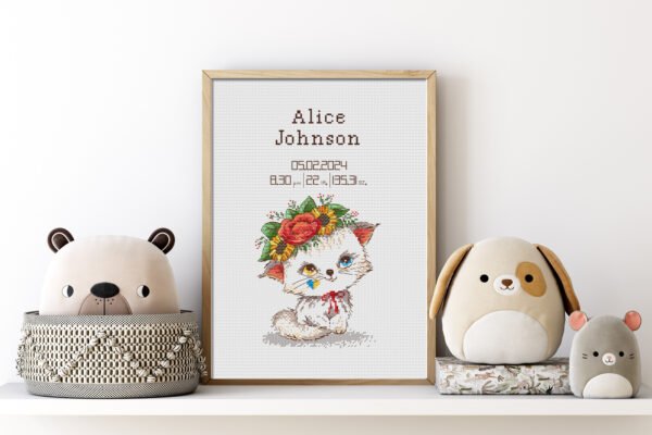 Framed Baby Kitty cross stitch birth announcement with pastel colors and space for personalized baby details