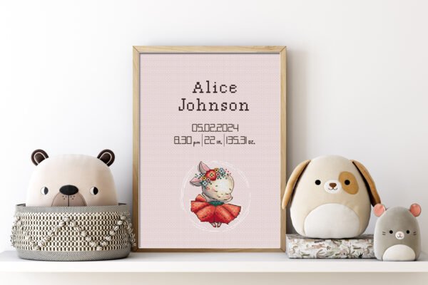 Framed dancing bunny birth stats cross stitch featuring personalized newborn details for nursery décor.