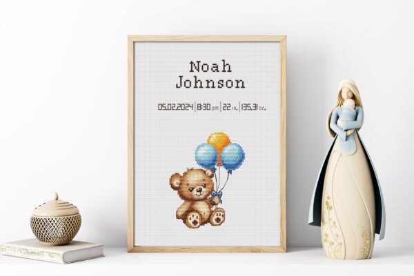 Framed Teddy Bear cross stitch birth announcement with pastel colors and personalized baby details