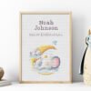 Framed bunny and elephant birth record cross stitch featuring personalized baby name, date and stats for nursery décor.