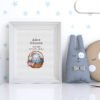 Framed baby girl birth announcement cross stitch featuring a sleeping bunny and personalized newborn details