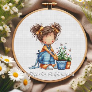 Whimsical girl cross stitch pattern in a wooden hoop with garden flowers and a tiny bee