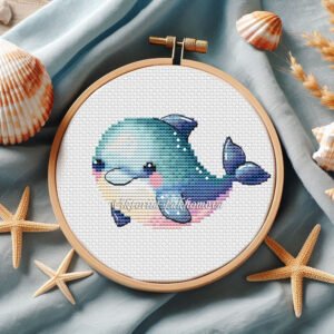 Cute baby dolphin cross stitch pattern in pastel ocean colors inside embroidery hoop