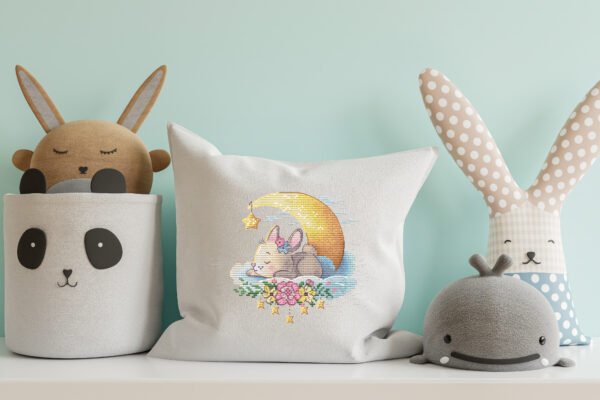 mock up pillowcase with sleeping bunny cross stitch pattern as nursery decor