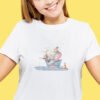 Elephant, bunny and cat sitting in a paper boat cross stitch design stitched on a white t‑shirt with soft pastel nursery details