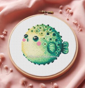 Cute baby puffer fish cross stitch pattern in colorful ocean tones inside embroidery hoop