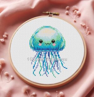 Cute baby jellyfish cross stitch pattern in pastel ocean colors inside embroidery hoop